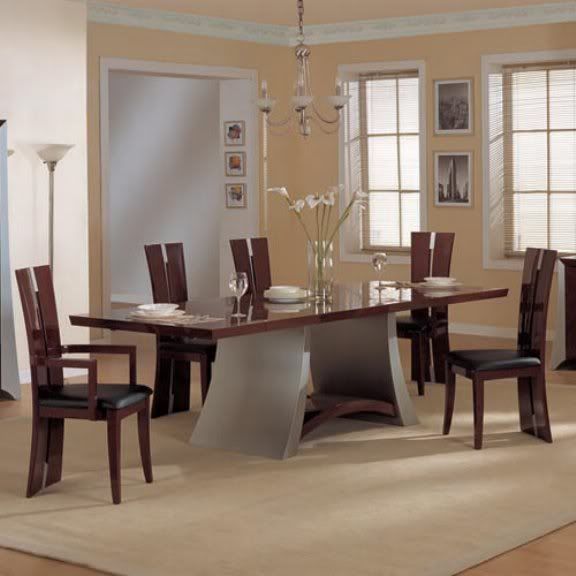 http://hometrenddesign.blogspot.com/Dramatic, sophisticated, and artistic, the Rosa Dining Table features a wooden table top with a unique contrasting pedestal, suited to an elegant table setting.