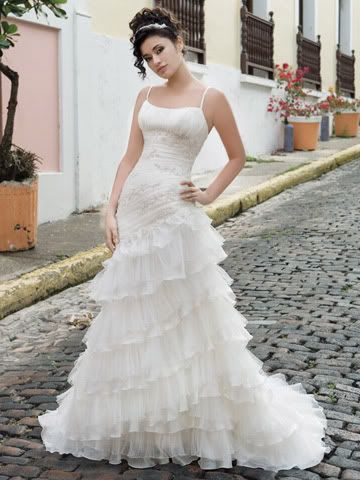 White tiered wedding dress with spaghetti straps