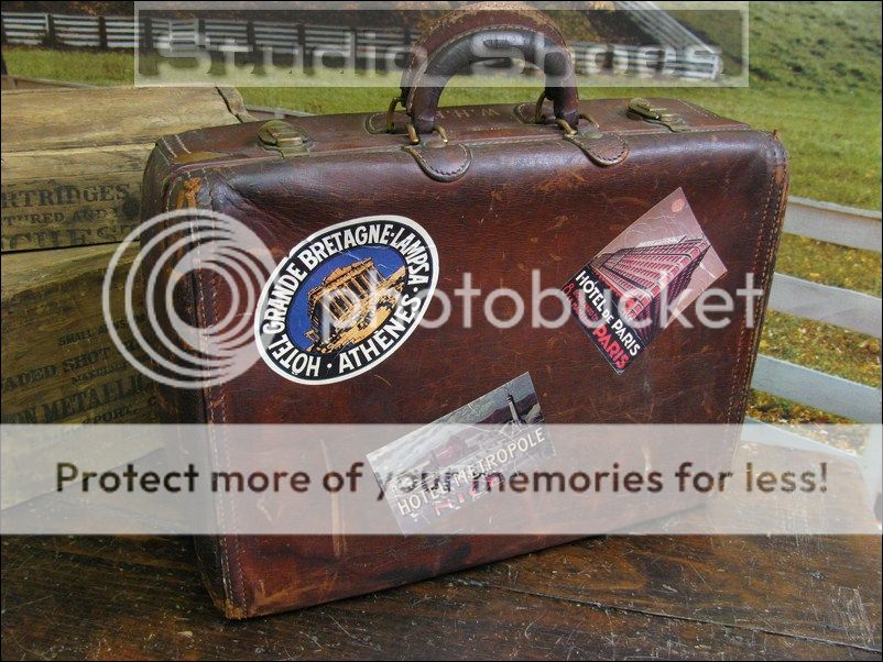   anique well traveled leather briefcase with european hotel emblem